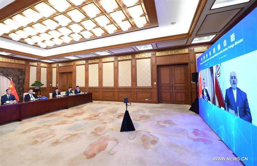 وزير الخارجية الصيني يعقد مؤتمرا عبر الفيديو مع نظيره الإيراني